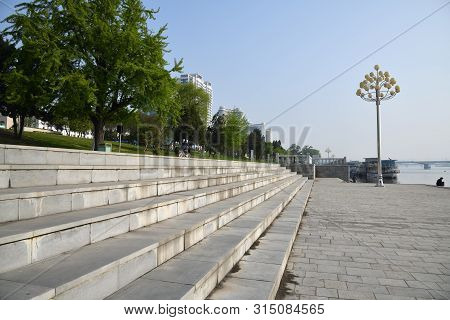 Pyongyang, North Korea - May 1, 2019: Waterfront Taedong River On Kim Il Sung Square Shown At The Mo