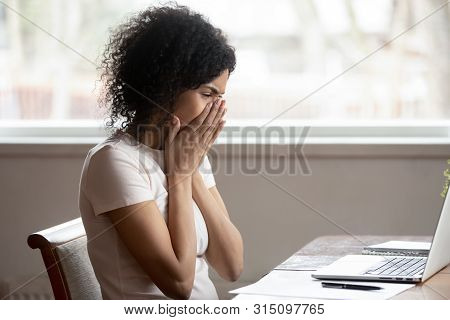 African Woman Cover Mouth With Hands Reading Awful News Online