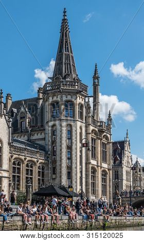 Gent, Flanders, Belgium -  June 21, 2019: School Children And Students Enjoying Sun Sitting On Quay 