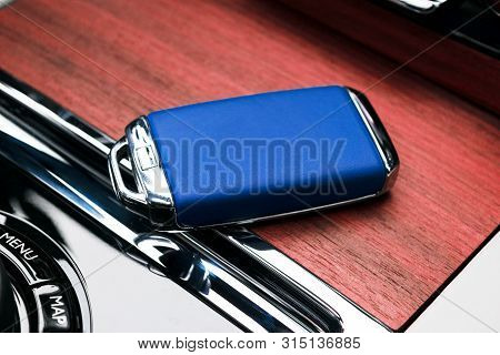 Closeup Inside Vehicle Of Wireless Blue Leather Key Ignition On White Leather Seat. Wireless Start E