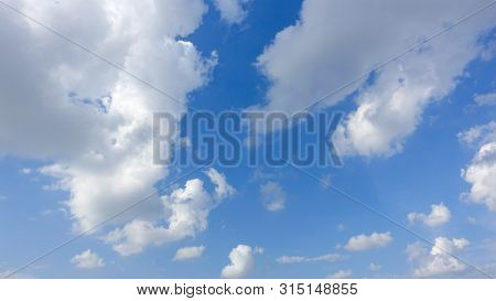 Beautiful Bright Blue Sky With White Fluffy Clouds On A Clear Sunny Day. Royalty High-quality Free S