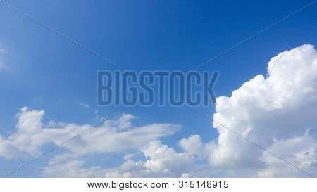 Beautiful Bright Blue Sky With White Fluffy Clouds On A Clear Sunny Day. Royalty High-quality Free S