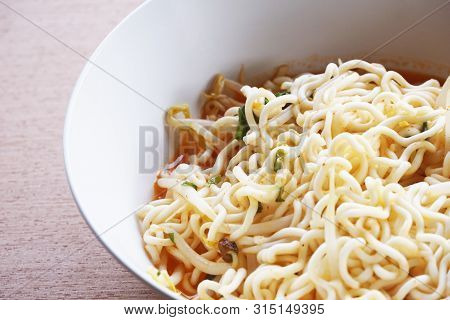 Close Up Dry Tomyum Noodle On Wooden Table