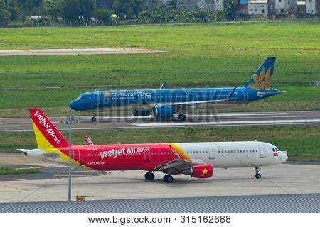 Saigon, Vietnam - Jul 13, 2019. Passenger Airplanes Taxiing On Runway Of Tan Son Nhat Airport (sgn) 