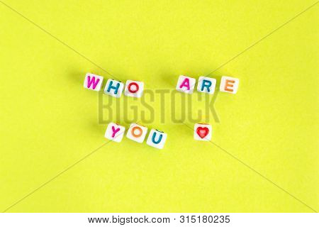 Phrase Who Are You Made Out Of Beads On Bright Background
