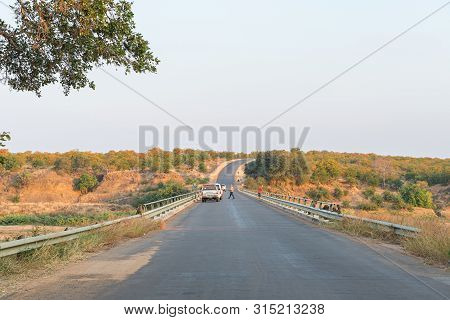 Kruger National Park, South Africa - May 7, 2019: Bridge On Road H1-6 Over The Letaba River. Vehicle