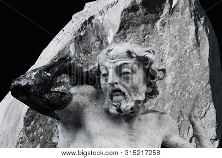 Ancient Statue Of Sisyphus With Stone. God Zeus Punished Sisyphus: He Had To Roll Very Big Stone To 