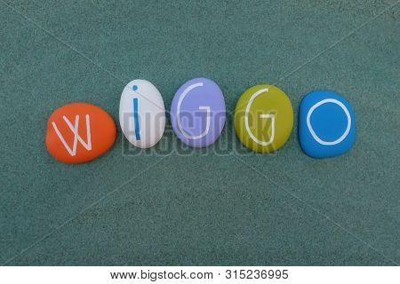 Wiggo, Masculine Scandinavian Given Name Composed With Multi Colored Stones Over Green Sand