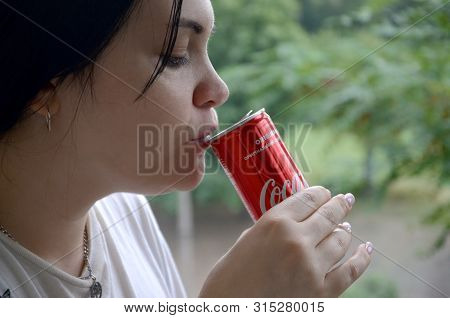 Caucasian Woman Drinking Coca Cola Bottle Red Tin Can 250ml