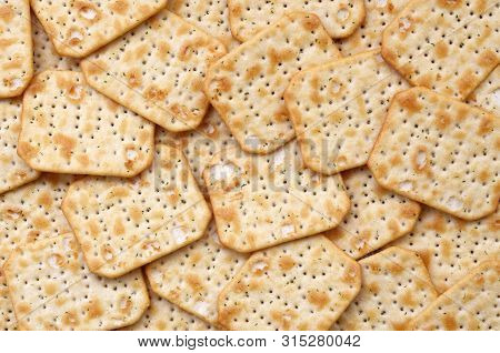 Tuc Original Snack Crackers Lies On Market Table Stacked In Big Pile