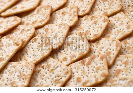 Tuc Original Snack Crackers Lies On Market Table Stacked In Big Pile