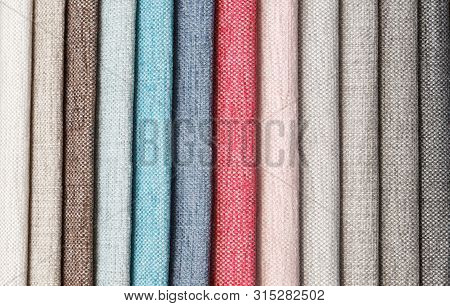 Multi-colored Samples Of Upholstery Fabric For Sofas And Chairs Close-up. Selection Of Fabric For In