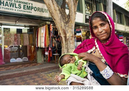 Indian Women Beggar Or Untouchables Caste Hold Baby And Begging Money From Travelers People At Janpa