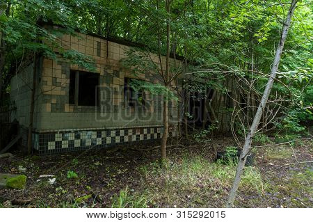 The Old Building Of The Soviet Era. Garage In The Chernobyl Region. Abandoned Garage.
