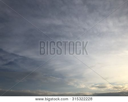 Beautiful Sky Painted By The Sun Leaving Bright Golden Shades.dense Clouds In Twilight Sky In Evenin
