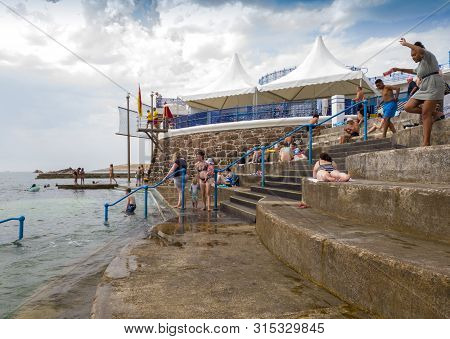 St Helier, Jersey, United Kingdom, - 07, 25, 2019: Holidaymakers Enjoying Facilities At The Sea Lido