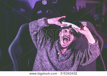 Man In Virtual Glasses Is Watching A Movie In 5D In A Cinema