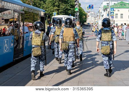 Russia, Moscow. July 27, 2019 Squad Policemen Are On Alert Along City Street To Place National Meeti