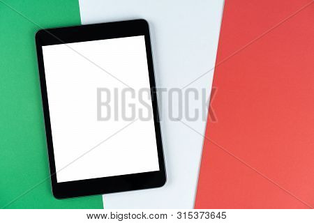 Black Tablet, E-book Is On Flag Italy. Texture Italian National Flag Colored Cardboard. Mock Up, Cop