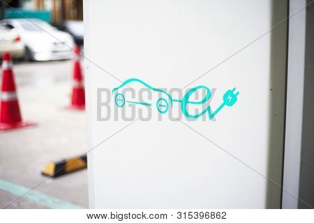 Electrical Car Charger Station In Parking Lot