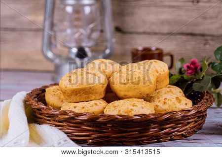 Pao De Queijo, Mineiro, Cheese Bread In Basket With Flowers.