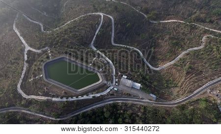 Rainfed Reservoirs Seen From Above Using Drones. Reservoirs For Water Reserves In Plantations