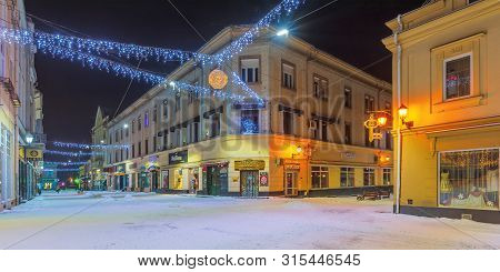 Uzhgorod, Ukraine - 06 Jan, 2019: Winter Night In Town. Wonderful Christmas Illumitation. Empty Korz