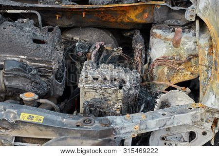 Burnt Car After A Fire, Body Parts Burnt Door Handles And Cracked Glass, The Picture Is Not Pleasant