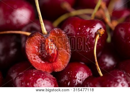 Sliced Cherry Closeup. A Lot Of Cherries. Juicy Cherry Close-up.