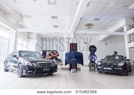 Novosibirsk, Russia - 08.03.2019: Exhibition At The Showroom Of A Dealership With Two Black Cars Por