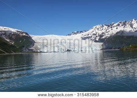 A Scenic View Of The Aialik Glacier In Kwnai Fjords National Park In Alaska.