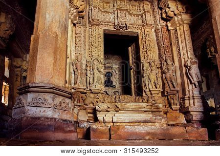 Inside Shive Temple In Khajuraho, India. Artworks, Reliefs And Altar With Statuette Of God In The 10