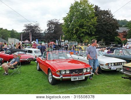 Hebden Bridge, West Yorkshire, United Kingdom - 4 August 2019:people Looking At Cars In The Public P