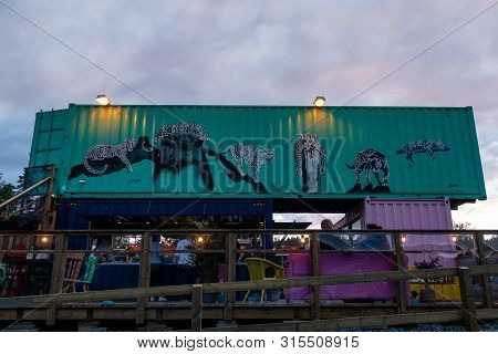 Ullared, Sweden - July 15, 2019: Outdoor Front Facade Night View Of  A Container Pop-up Restaurant A