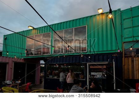 Ullared, Sweden - July 15, 2019: Outdoor Front Facade Night View Of  A Container Pop-up Restaurant W