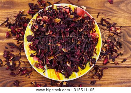 Dried Hibiscus (carcade, Roselle) On Wooden Table