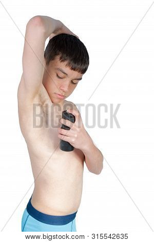 Teenage Boy Using An Under Arm Spray Isolated On A White Background