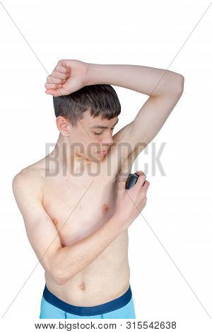 Teenage Boy Using An Under Arm Spray Isolated On A White Background