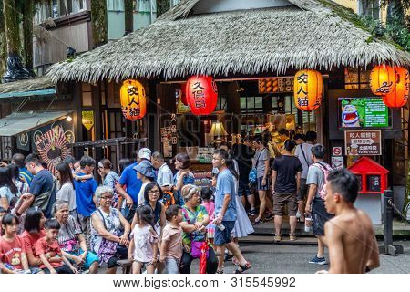 Travelers At Xitou Monster Village