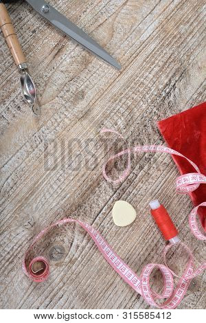 Sewing Tools And Sewing Supplies Accessories Sewing On Wooden Table.