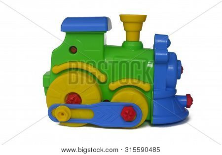 Green, Yellow, Red, Blue Train Toy On A White Background Isolate