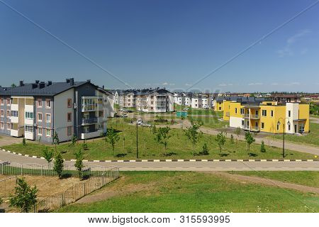 Low-rise Apartment Buildings In The New District Of Krasnodar On The Street Schumann. Sunny Summer D