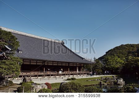 Arashiyama, Japan - April 17th, 2018: Tenryuji Temple Overlooking A Pond On A Warm Spring Day In Ara