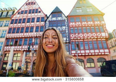 Beautiful Smiling Woman Take Self Portrait In Romerberg Square In Frankfurt, Germany