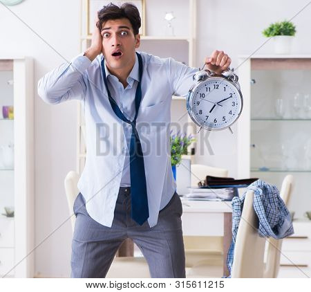 Businessman late for office due to oversleeping after overnight 