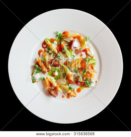 Pasta alla Norma cooked in modern way, served as cold appetizer, isolated on black background