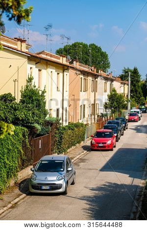 Rovigo, Italy - July, 7, 2019: cars parked on the street in Rovigo, Italy