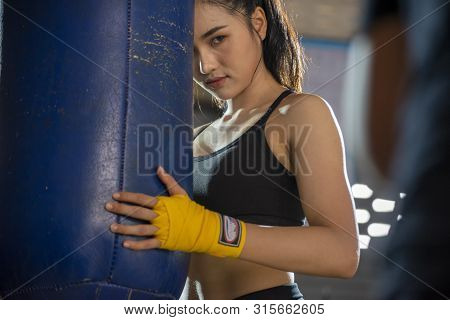 Boxing Woman Prepare To Trianing Session And Kickboxing,workout At Thai Boxing Gym.fit Female Exerci