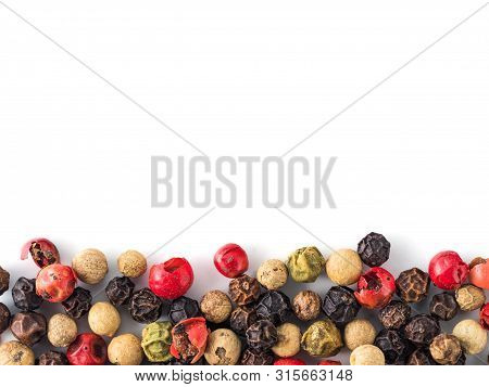 Mixed Peppercorns Background With White Copy Space In Center. Food Background With Peppercorns. Diff