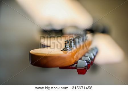 Uppermost Part Of The Electronic Guitar. Horizontal Conceptual Close-up View Of Guitar Mechanism For